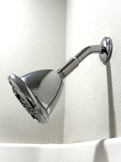 MagSert Shower Extender installed between the shower arm and the showerhead