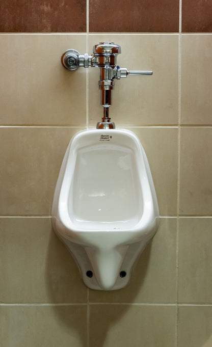 MagSert® Urinal U-782 installed on the water supply line of a commercial urinal
